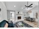 Bright living room featuring a fireplace and dining area with hardwood flooring at 1393 Secessionville Rd, Charleston, SC 29412