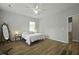 Minimalist bedroom with hardwood floors, a cozy bed, and natural light at 1493 Little Rock Blvd, Charleston, SC 29412