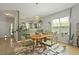 The dining space showcases a table, view to the kitchen, and a large sunny window at 1493 Little Rock Blvd, Charleston, SC 29412