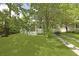Home with a well-maintained front yard and driveway, providing ample space and a classic look at 1493 Little Rock Blvd, Charleston, SC 29412