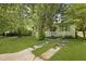 Home with a meticulously maintained front yard and a quaint porch, exuding charm and elegance at 1493 Little Rock Blvd, Charleston, SC 29412