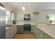 Well-lit kitchen featuring stainless steel appliances, ample counter space, and updated cabinets at 1493 Little Rock Blvd, Charleston, SC 29412