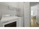 Laundry room with side-by-side washer and dryer, shelving and a doorway to another room, showing functionality at 1493 Little Rock Blvd, Charleston, SC 29412