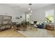 Stylish living room featuring modern furniture, bright lighting, and hardwood floors at 1493 Little Rock Blvd, Charleston, SC 29412