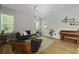 Bright living room with hardwood floors, a comfortable sofa, and natural light from the windows at 1493 Little Rock Blvd, Charleston, SC 29412