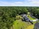 Aerial view of the property featuring the home, expansive backyard, and wooded surroundings at 1514 Stanwick Dr, Johns Island, SC 29455