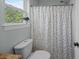 Bathroom featuring a shower with patterned shower curtain and a toilet at 1514 Stanwick Dr, Johns Island, SC 29455