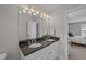 Well lit bathroom featuring a double vanity with stone countertop and decorative lighting at 1514 Stanwick Dr, Johns Island, SC 29455