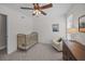 Bedroom featuring a brass crib, white chair and ceiling fan at 1514 Stanwick Dr, Johns Island, SC 29455
