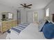 Spacious main bedroom featuring large windows, a dresser and a comfortable bed with stylish bedding at 1514 Stanwick Dr, Johns Island, SC 29455