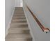 Carpeted staircase leading to the upper level with a sturdy wooden handrail at 1514 Stanwick Dr, Johns Island, SC 29455