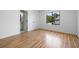 Spacious bedroom with hardwood floors, a large window, and ample natural light at 1530 Fort Johnson Rd # 2E, Charleston, SC 29412
