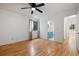 Bedroom with hardwood flooring, ceiling fan and a view to the bathroom at 1530 Fort Johnson Rd # 2E, Charleston, SC 29412