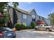 Exterior of a multi-story building with well-maintained landscaping and parking at 1530 Fort Johnson Rd # 2E, Charleston, SC 29412