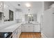 White kitchen featuring modern appliances and finishes, with an open view to an adjacent room at 1530 Fort Johnson Rd # 2E, Charleston, SC 29412