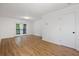 Bright living room with wood floors and French doors leading to an outdoor space at 1530 Fort Johnson Rd # 2E, Charleston, SC 29412