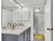Modern bathroom with vanity, ample counter space, patterned mirror, and step-in shower at 1723 Live Oak Park, Seabrook Island, SC 29455