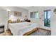 Bright bedroom with art, lamp, comfortable bed with patterned pillow and exterior view from the private door at 1723 Live Oak Park, Seabrook Island, SC 29455