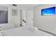 Cozy bedroom features light walls, TV, and ensuite bathroom for convenient living at 1723 Live Oak Park, Seabrook Island, SC 29455