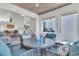 Sunroom dining area connects to a cozy living space and sun-drenched deck at 1723 Live Oak Park, Seabrook Island, SC 29455