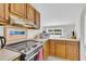 Efficient kitchen with ample counter space, stainless steel range, and abundant natural light at 1723 Live Oak Park, Seabrook Island, SC 29455