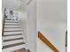 Well-lit stairway with hardwood railing, complemented by light walls and a sleek design at 1723 Live Oak Park, Seabrook Island, SC 29455