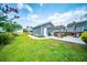 Expansive backyard featuring a grilling area, patio with pergola, and lush lawn perfect for outdoor activities at 1726 Winfield Way, Charleston, SC 29414