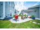 Charming backyard with a concrete patio, complete with string lights, a grill, and a cozy pergola-covered seating area at 1726 Winfield Way, Charleston, SC 29414