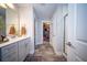 Bright and airy bathroom with dual sinks, vanity, and walk-in shower offering a spa-like experience at 1726 Winfield Way, Charleston, SC 29414