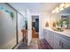 Bright bathroom featuring a double vanity, glass shower, and decorative accents for a spa-like feel at 1726 Winfield Way, Charleston, SC 29414