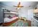 Well-organized bedroom with bunk beds, a play area, hardwood floors, and neutral gray walls at 1726 Winfield Way, Charleston, SC 29414