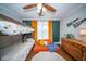 Cozy ' bedroom with bunk beds, orange futon, and decorative pennants on the wall at 1726 Winfield Way, Charleston, SC 29414