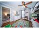 Charming bedroom with hardwood floors, bunk beds, and a fun city-themed rug at 1726 Winfield Way, Charleston, SC 29414