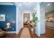 Bright hallway with hardwood floors, elegant decor, and a view into the kitchen and living room at 1726 Winfield Way, Charleston, SC 29414