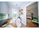 Well-lit home office setup with modern desk and a view to the outside at 1726 Winfield Way, Charleston, SC 29414