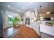Bright kitchen featuring white cabinetry, stainless steel appliances, and access to an outdoor balcony through glass doors at 1726 Winfield Way, Charleston, SC 29414
