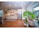 Airy kitchen featuring white cabinets, stainless steel appliances and a garden view from a large window at 1726 Winfield Way, Charleston, SC 29414