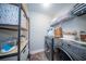 Well-organized laundry room with modern washer and dryer, and ample shelving for storage at 1726 Winfield Way, Charleston, SC 29414