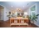 Inviting living room showcases a console table with basket storage, plants, recessed lights, and windows for natural light at 1726 Winfield Way, Charleston, SC 29414