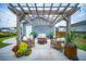 Inviting outdoor patio with pergola, fire pit, and cozy seating, perfect for enjoying evenings and gatherings at 1726 Winfield Way, Charleston, SC 29414
