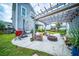 Inviting backyard patio featuring a pergola, fire pit, grill, and comfortable seating perfect for outdoor entertaining at 1726 Winfield Way, Charleston, SC 29414