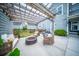 Beautiful outdoor patio with pergola, fire pit, and comfortable seating, great for relaxing and entertaining at 1726 Winfield Way, Charleston, SC 29414