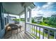 Inviting covered porch with chairs provides a relaxing outdoor space with views of the neighborhood at 1726 Winfield Way, Charleston, SC 29414