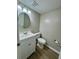 Bathroom featuring a vanity with sink, mirror, and toilet; with laminate flooring at 1820 Mepkin Rd # 1019, Charleston, SC 29407