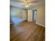 A spacious bedroom with neutral walls, laminate flooring, and a ceiling fan at 1820 Mepkin Rd # 1019, Charleston, SC 29407