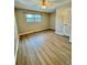 Bedroom featuring a window, ceiling fan, closet, and wood-look flooring at 1820 Mepkin Rd # 1019, Charleston, SC 29407
