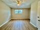 Bedroom featuring a window, ceiling fan, and wood-look flooring at 1820 Mepkin Rd # 1019, Charleston, SC 29407