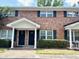 Traditional brick townhouse with a covered entrance and well-maintained landscaping at 1820 Mepkin Rd # 1019, Charleston, SC 29407