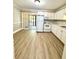 A bright kitchen featuring white cabinets, a refrigerator, and a sliding glass door to a patio at 1820 Mepkin Rd # 1019, Charleston, SC 29407