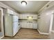 Bright kitchen featuring stainless steel appliances, ample counter space, and laminate flooring at 1820 Mepkin Rd # 1019, Charleston, SC 29407